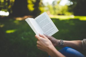 photo of person reading a book