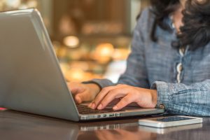 photo of woman using laptop