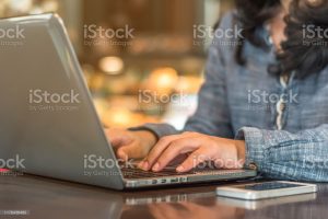 photo of woman using a laptop